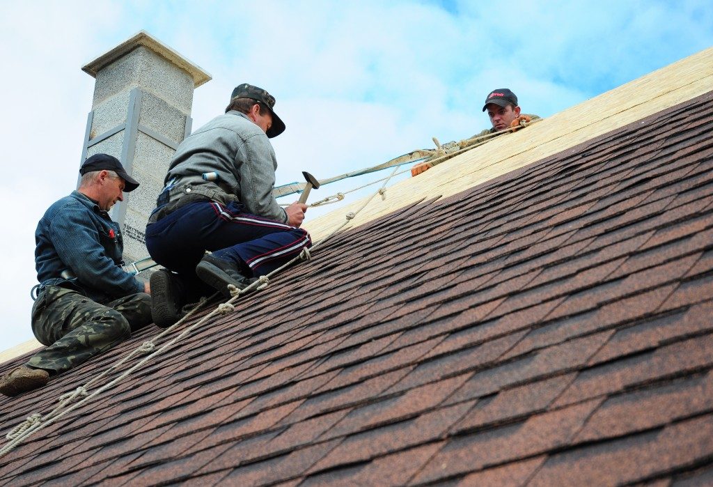 Men constructing roof