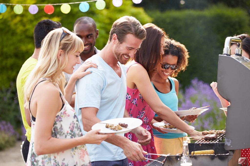 Friends in a party getting food