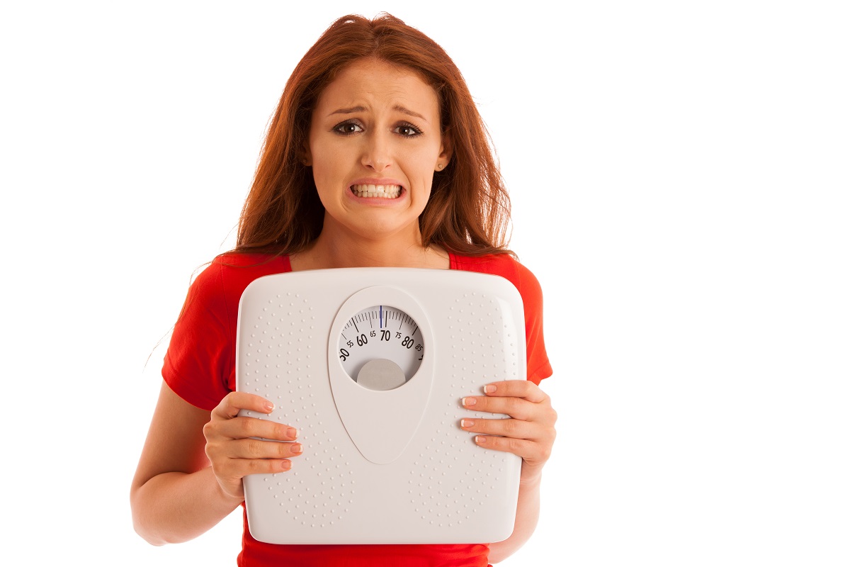 girl  with weighing scale