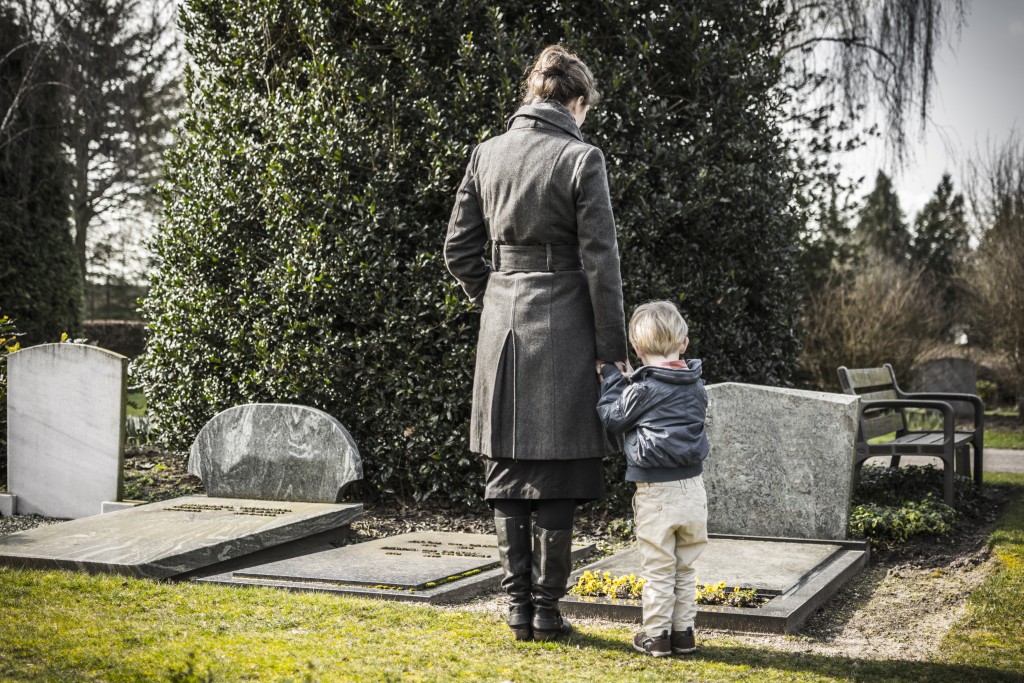 mother and child at a cemetery