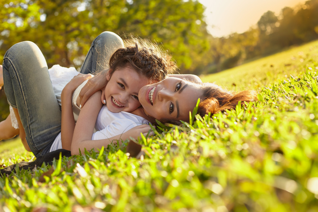 mother and daughter playing outside