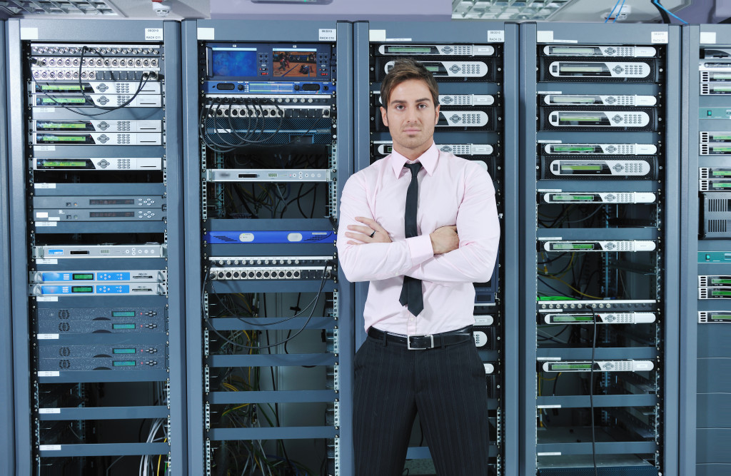 Man standing inside a server room