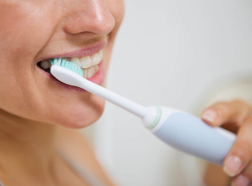 woman using an electric brush