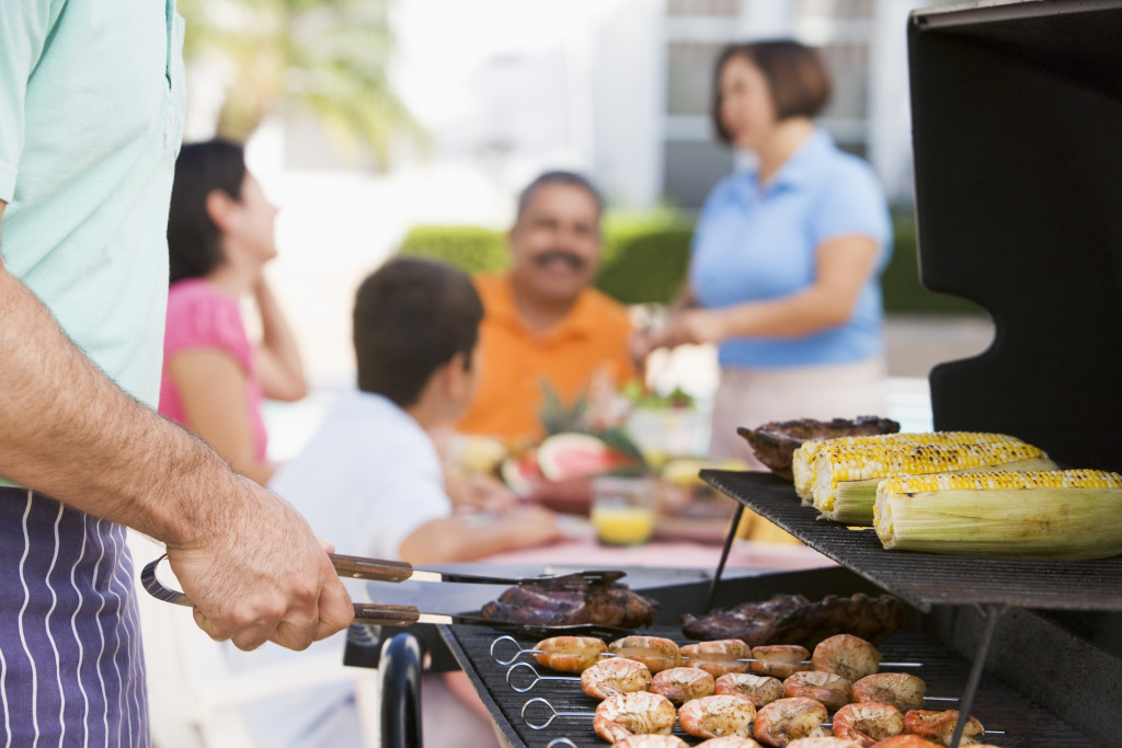 Family Enjoying A Barbeque