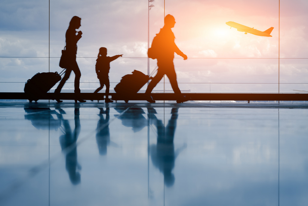 family boarding a plane