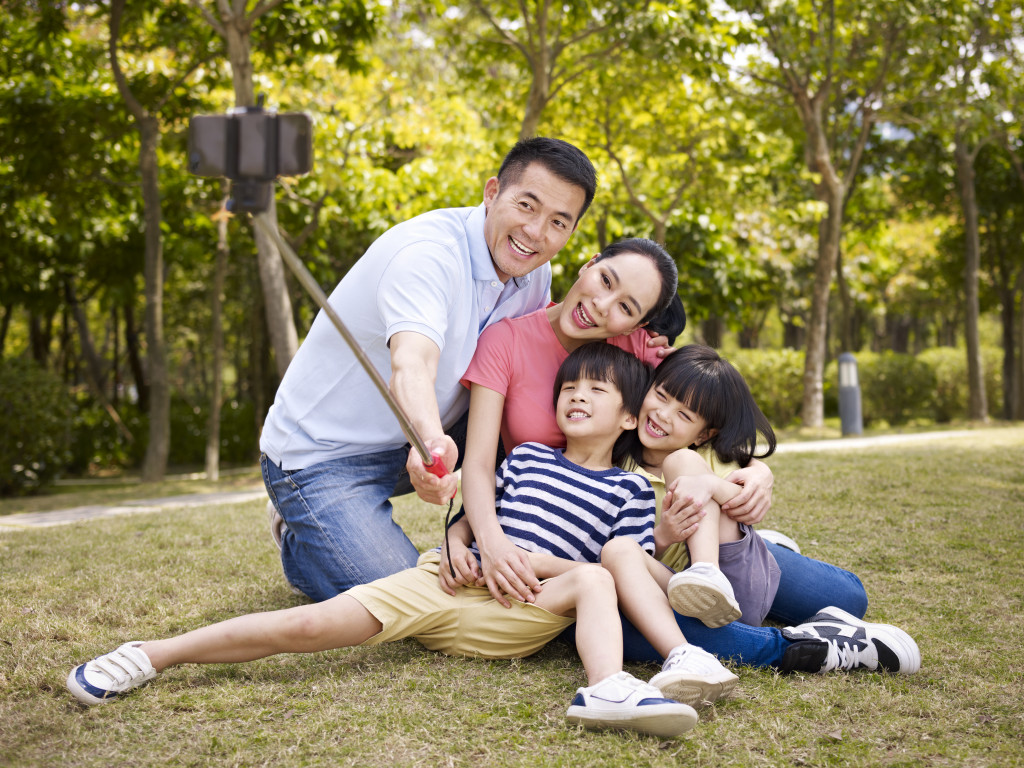 Family takes selfie photo outdoors