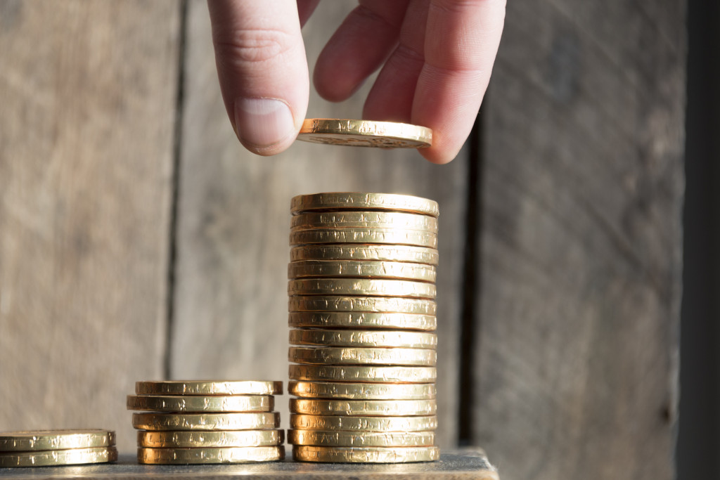 Stacking coins representing savings