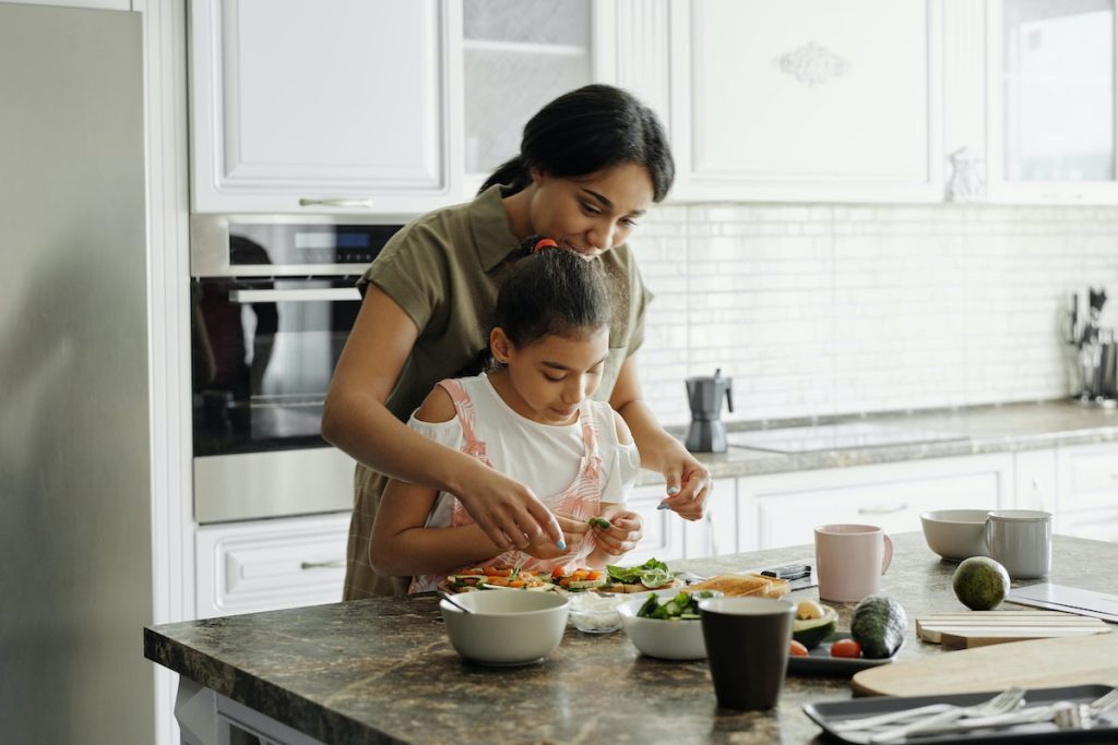 mom and child preparing a healthy meal