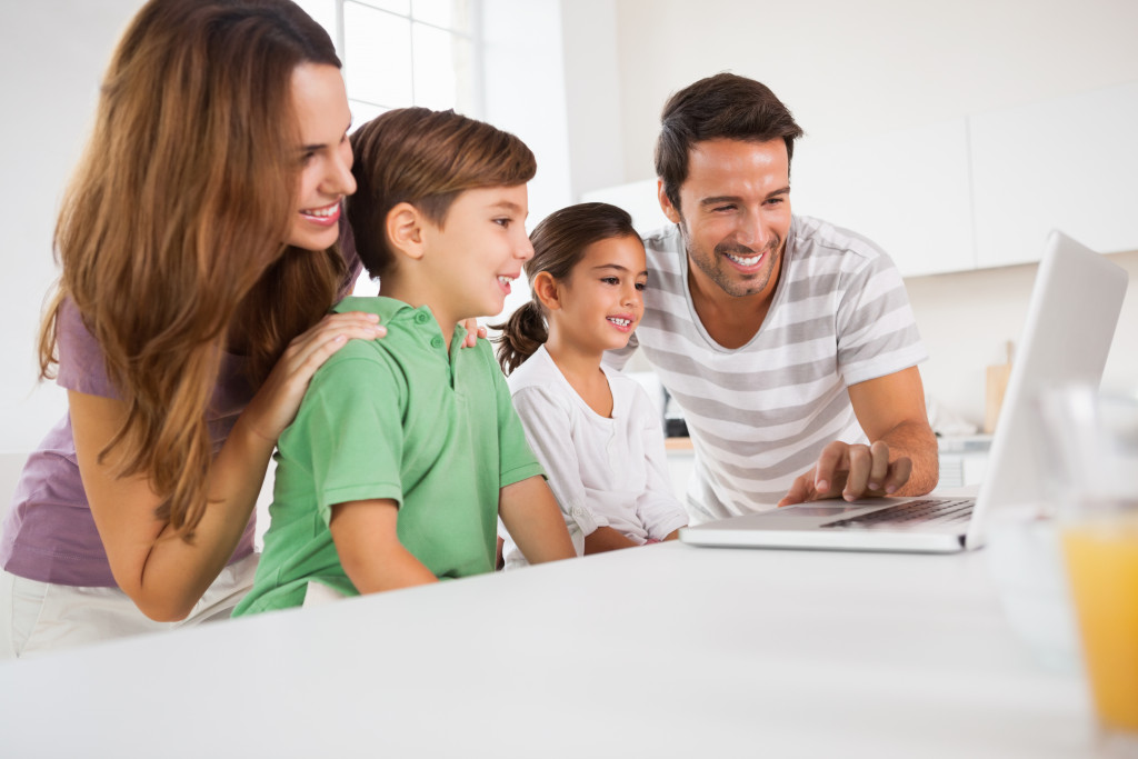 happy family using laptop