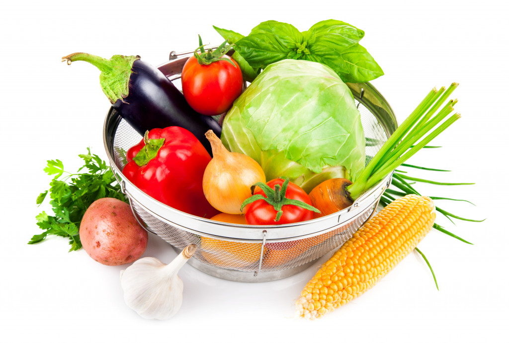 Healthy fruits and vegetables on a strainer