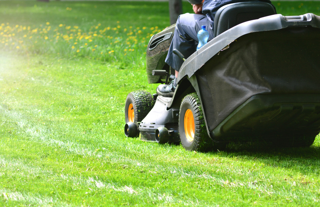 A person mowing a lawn