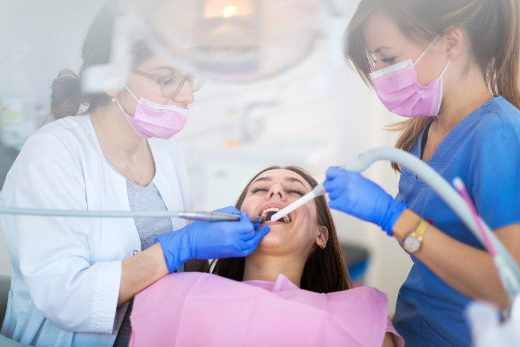 A woman having her teeth professionally cleaned