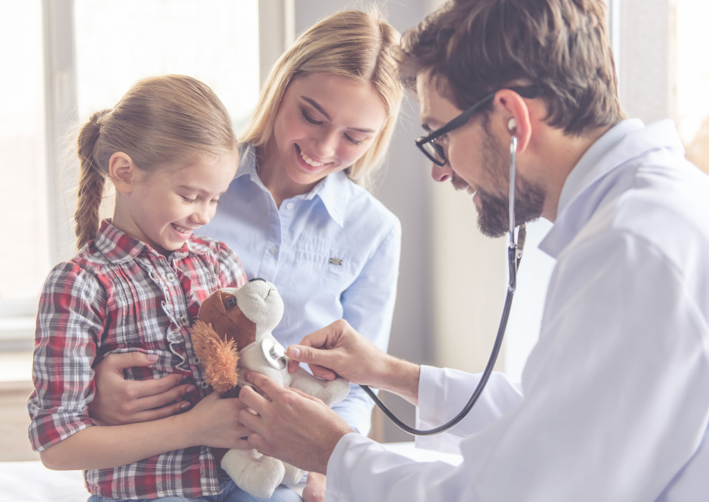 doctor with patients mom and daughter