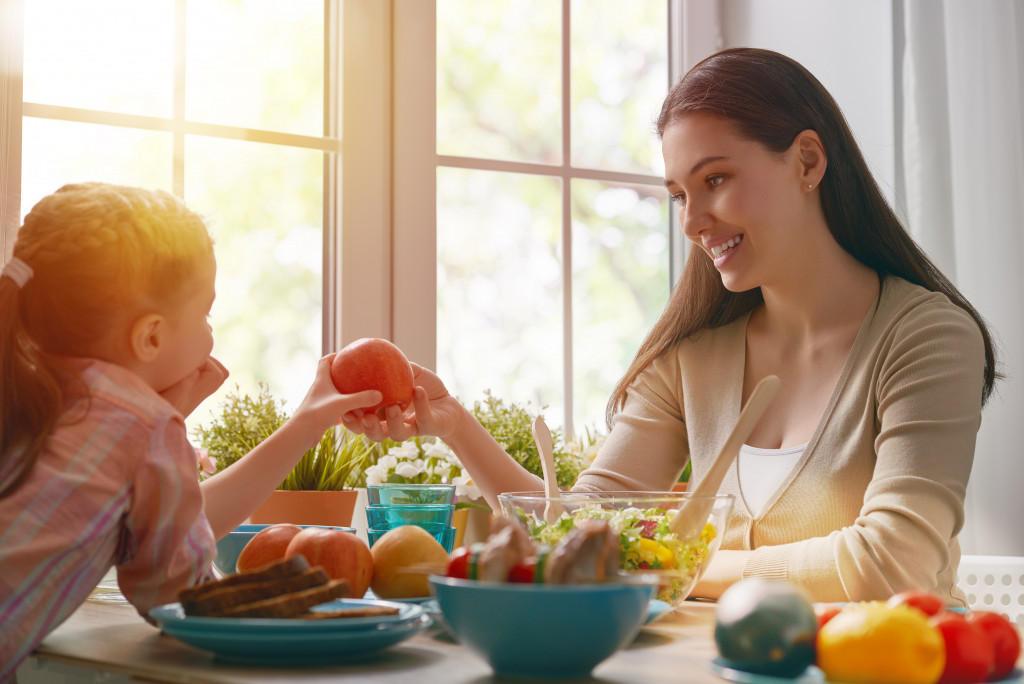 Kid and parent eating healthy