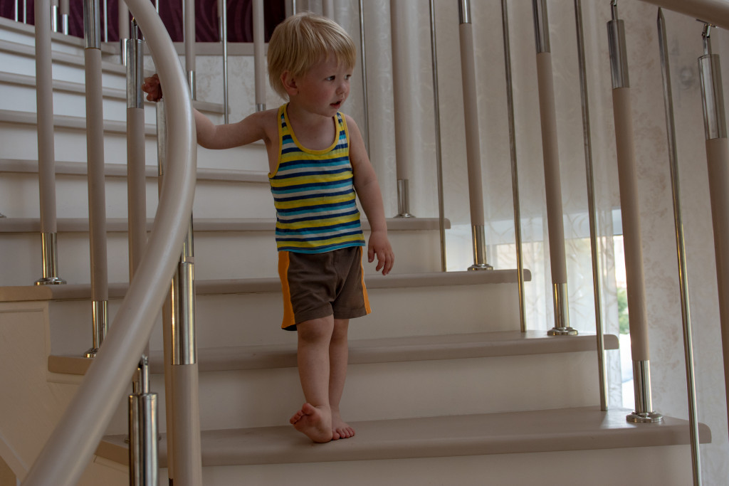 Kid walking safely on the stairs