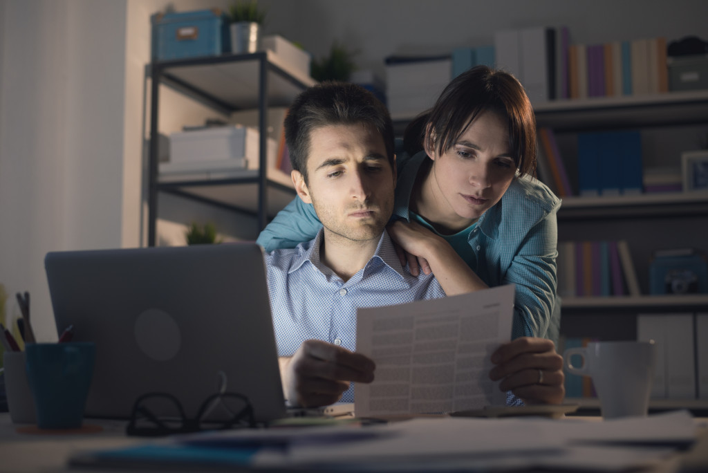 young couple looking at documents together