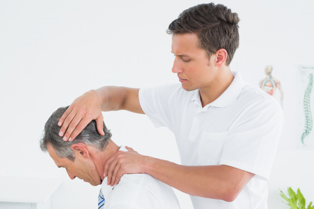 A chiropractor treating a patient