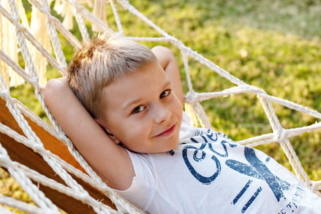 A young boy in a hammock