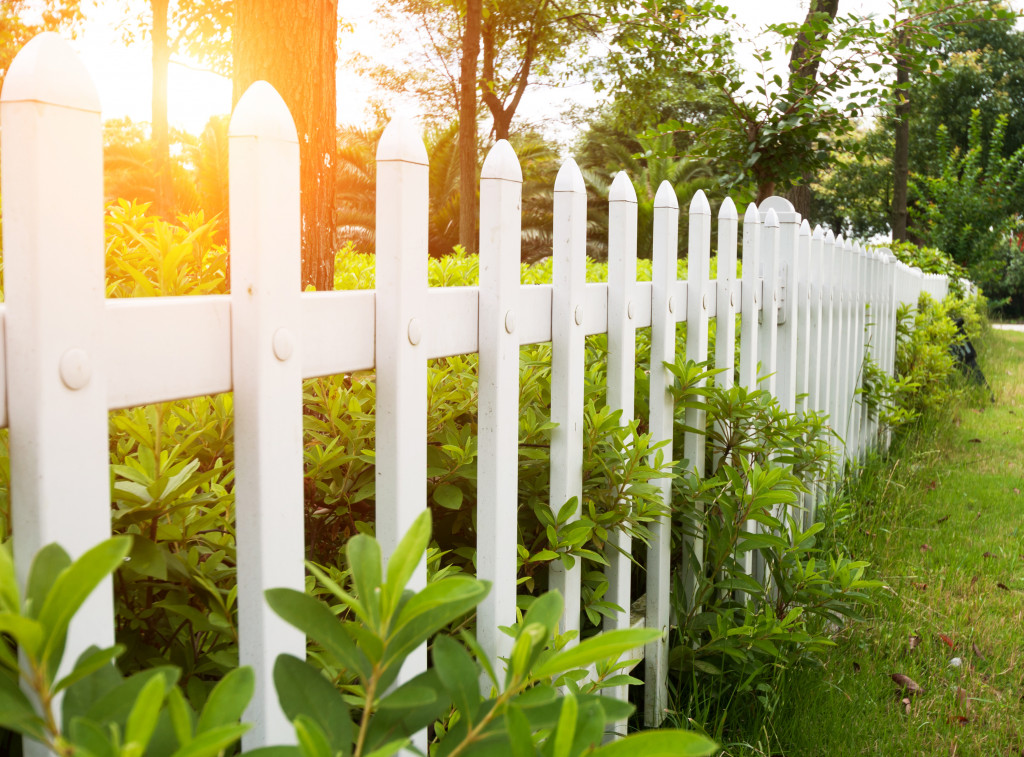 A whitewashed fence at a backyard