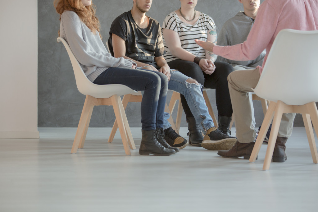 Young people in a support group therapy session