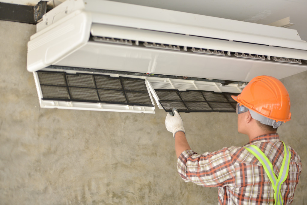 A technician installing an air conditioner