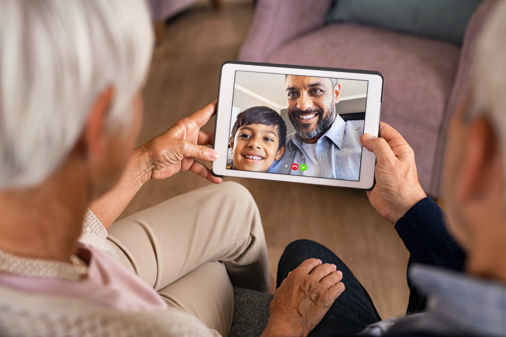 senior parents on a call with son and grandson