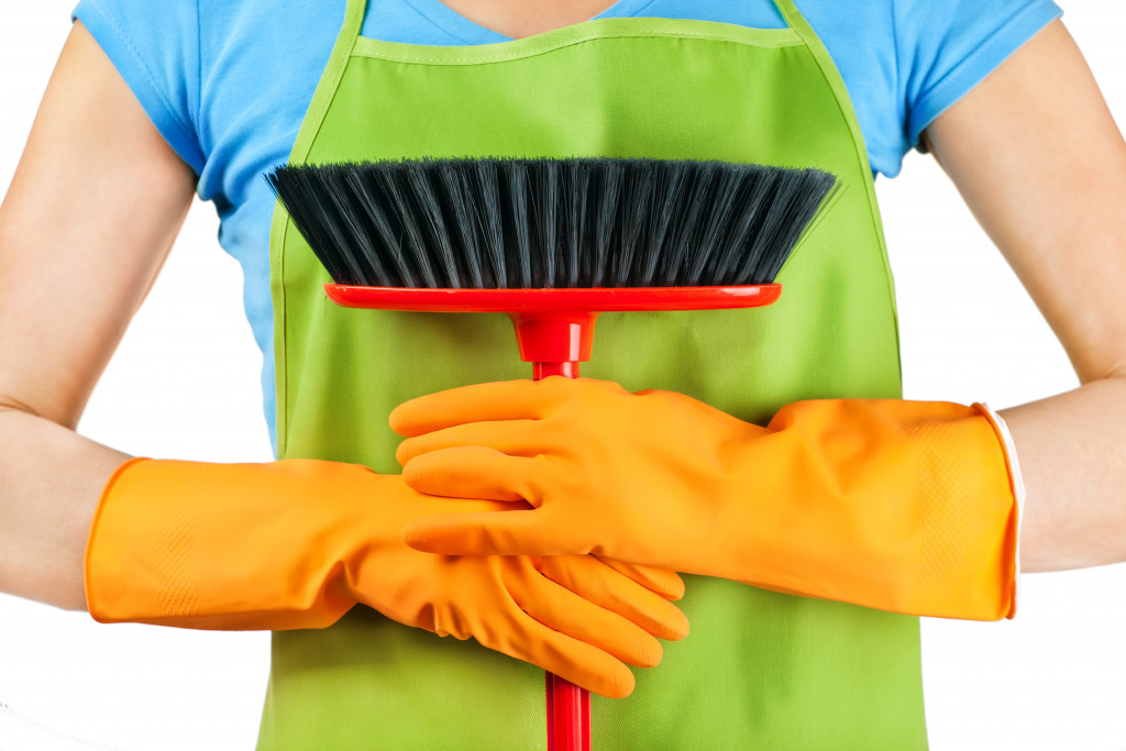 woman holding a cleaning brush