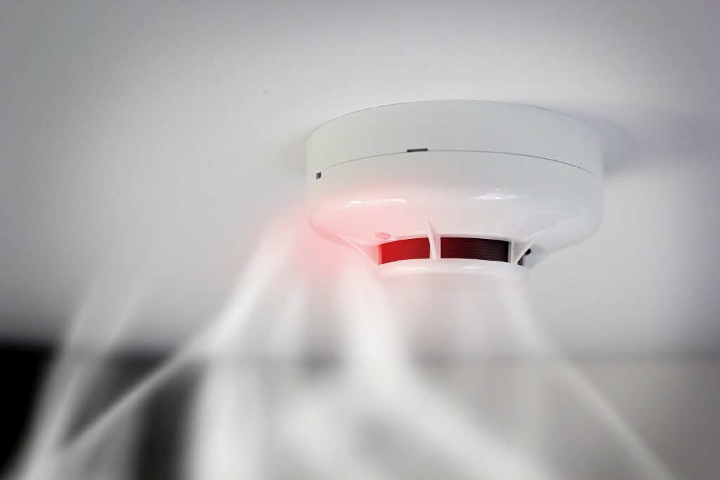 A smoke detector glowing red