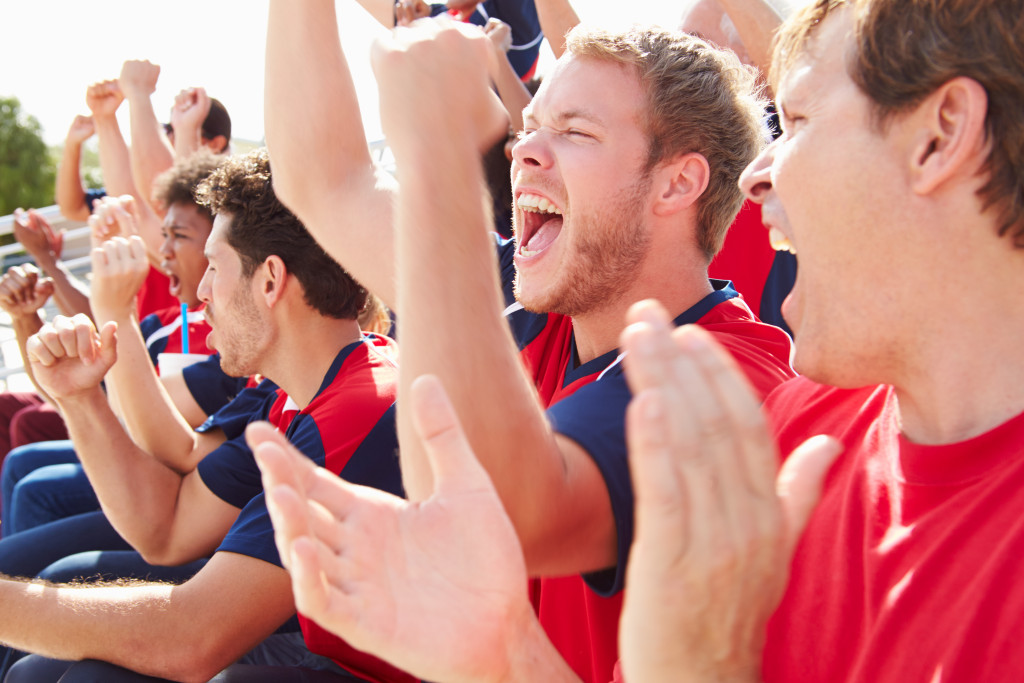 Parents watching kids in youth sports