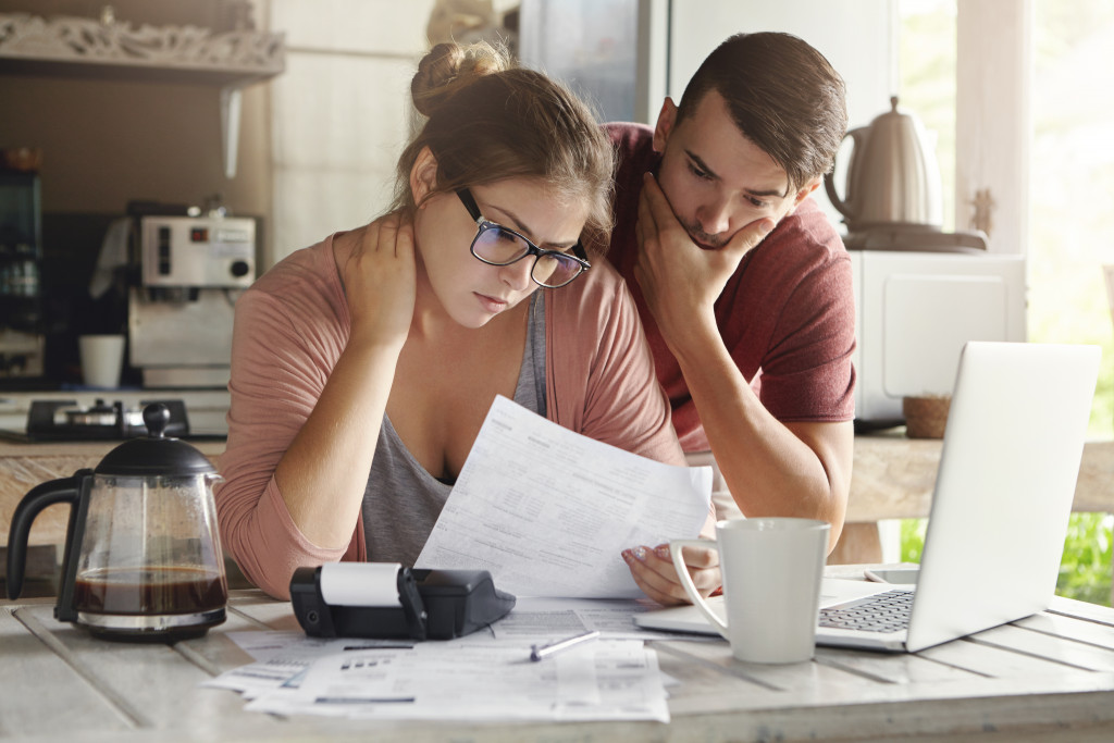 couple budgeting at the kitchen