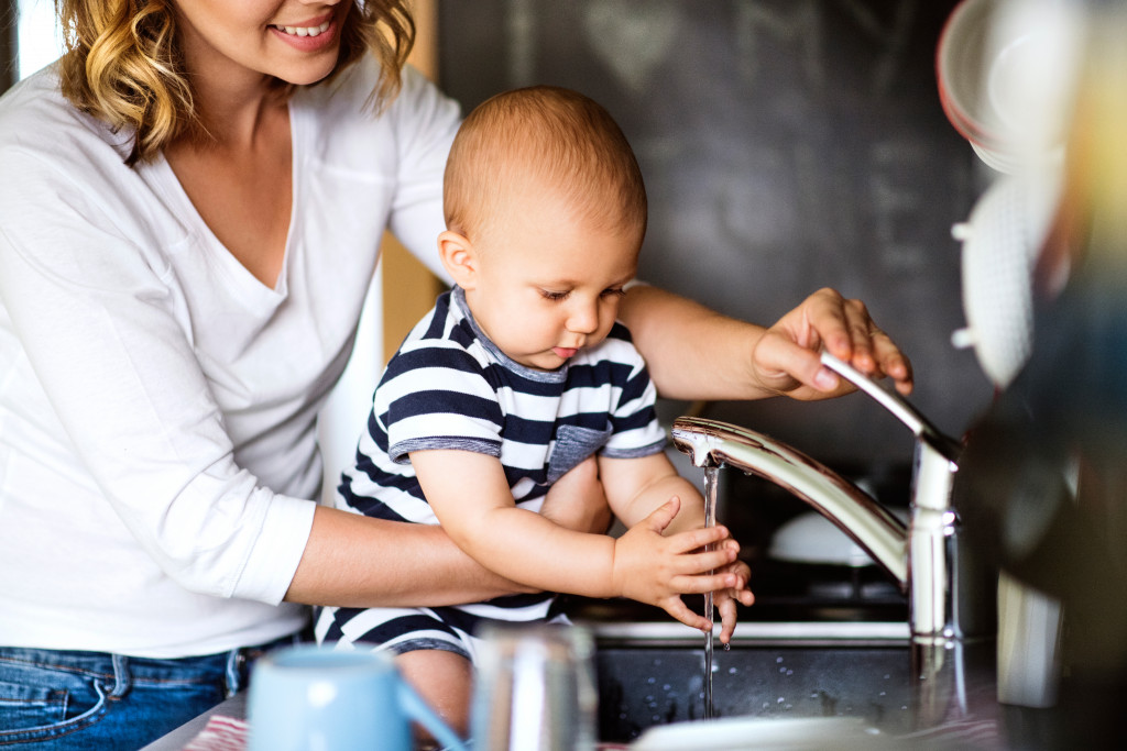 mom and baby washing their hands