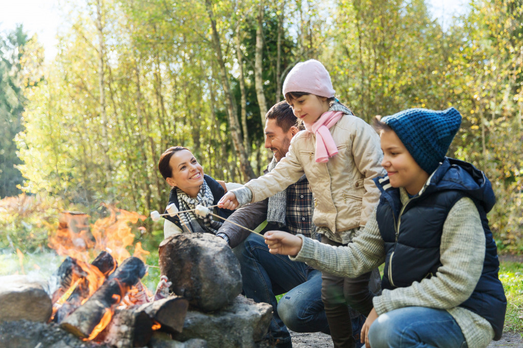 family on the fire pit roasting mallows