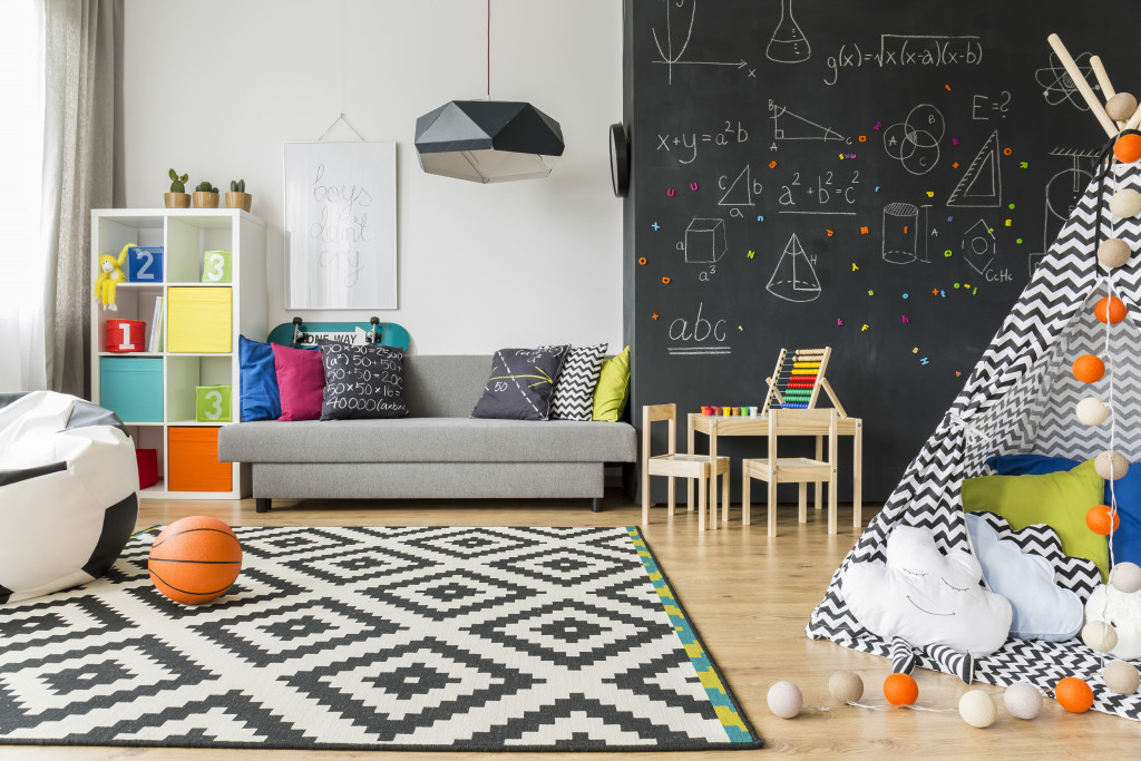 minimalist gender neutral playroom with organized toys