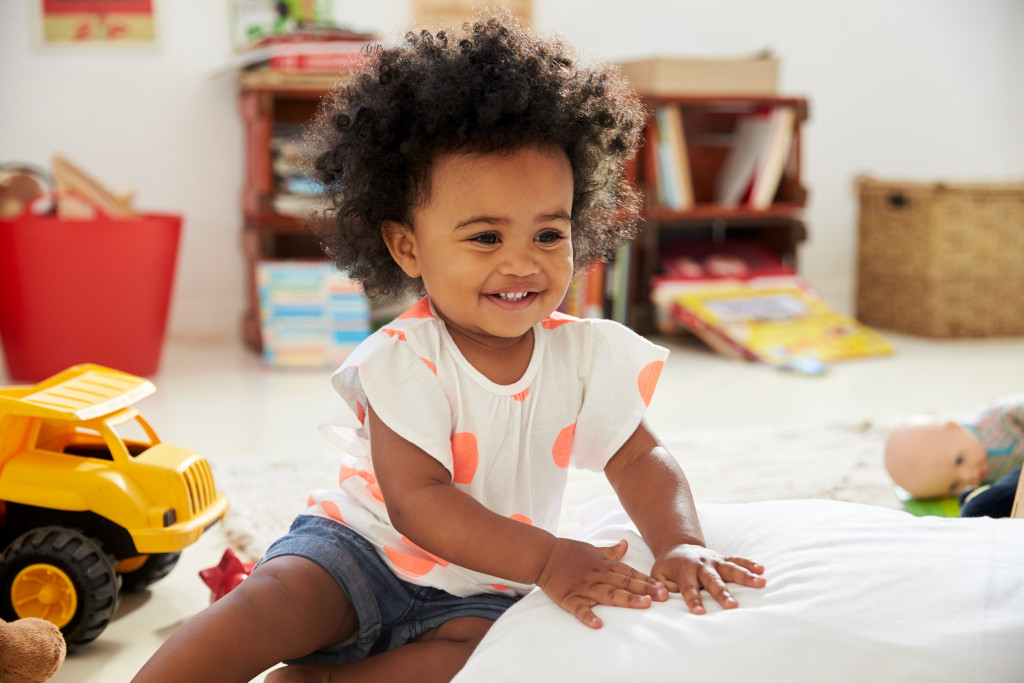 little girl playing on the floor