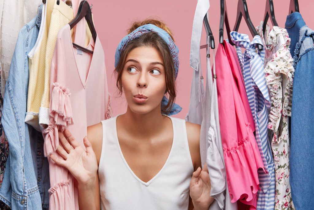 cute woman clothing inside her closet