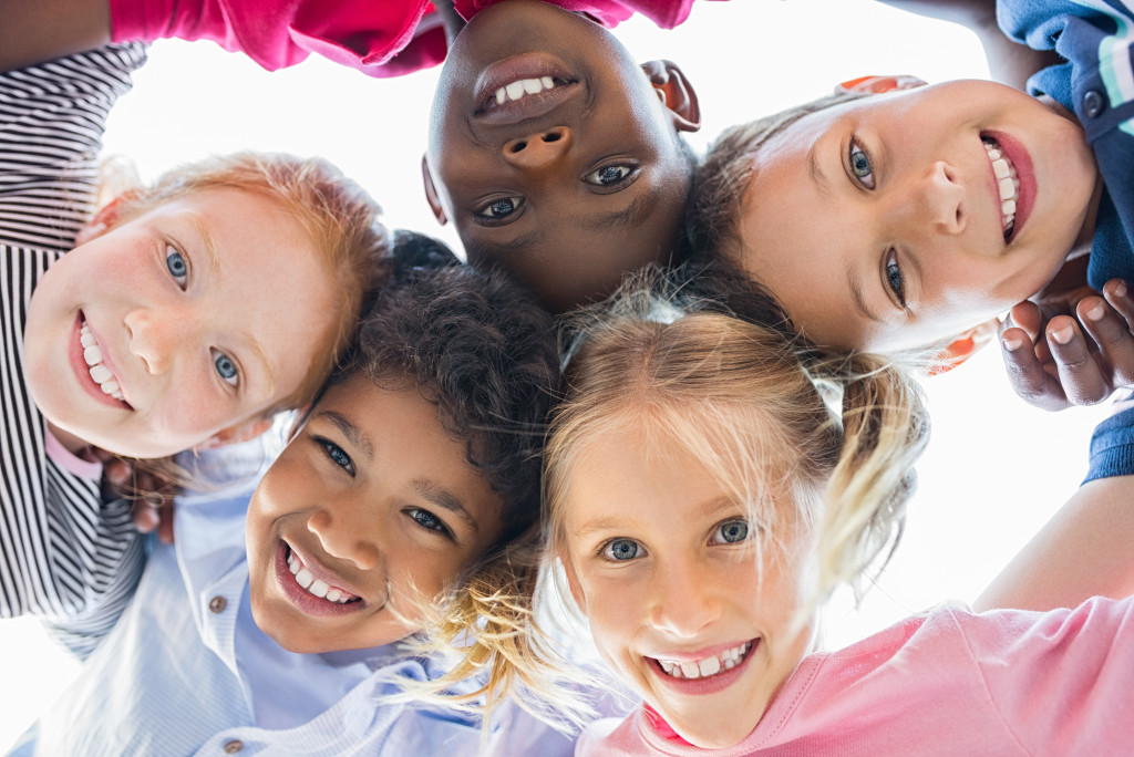 Closeup shot of the faces of happy kids