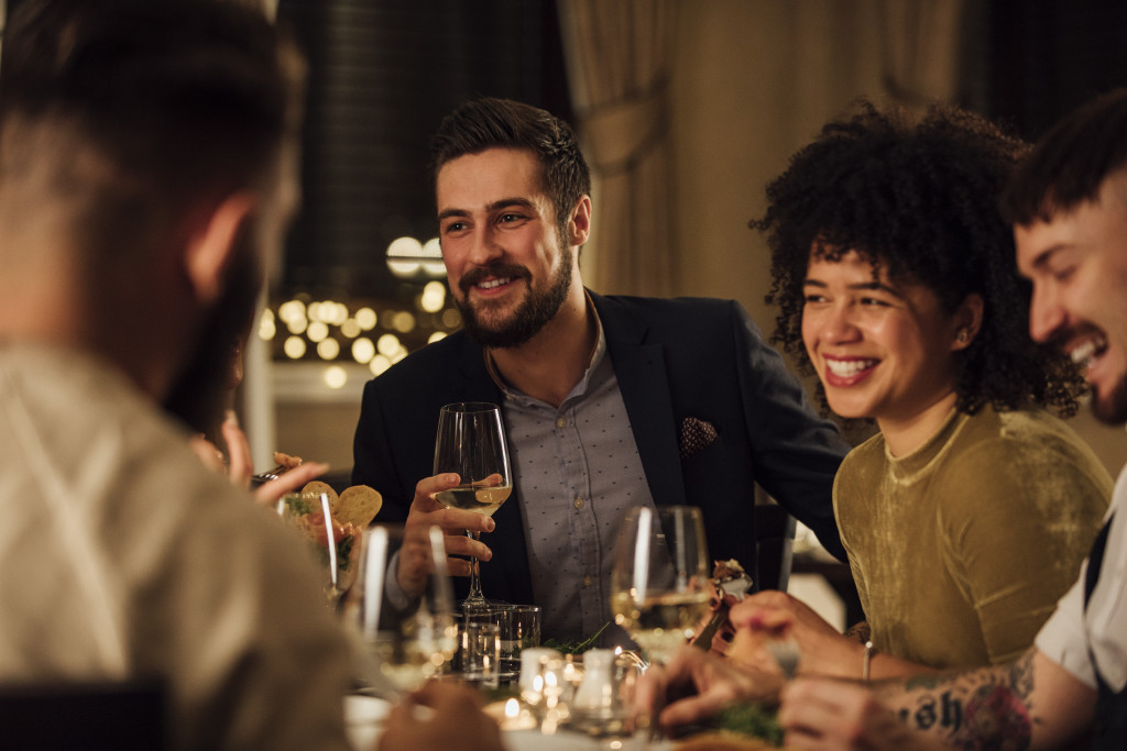 friends having dinner and drinking wine