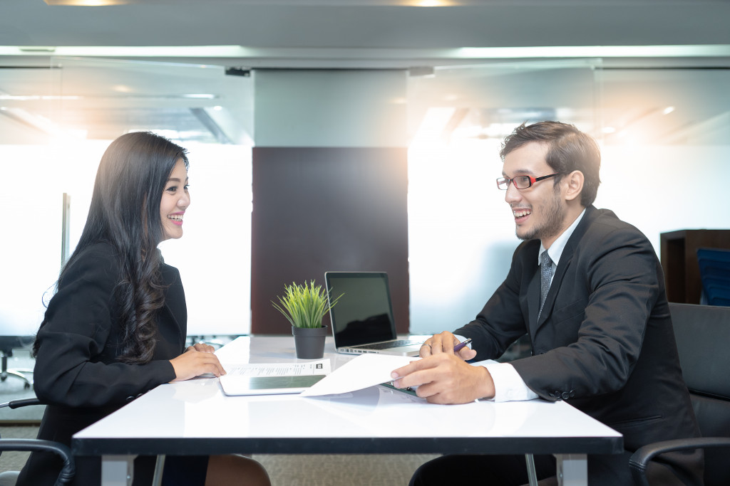 Young woman attending an interview at an office.