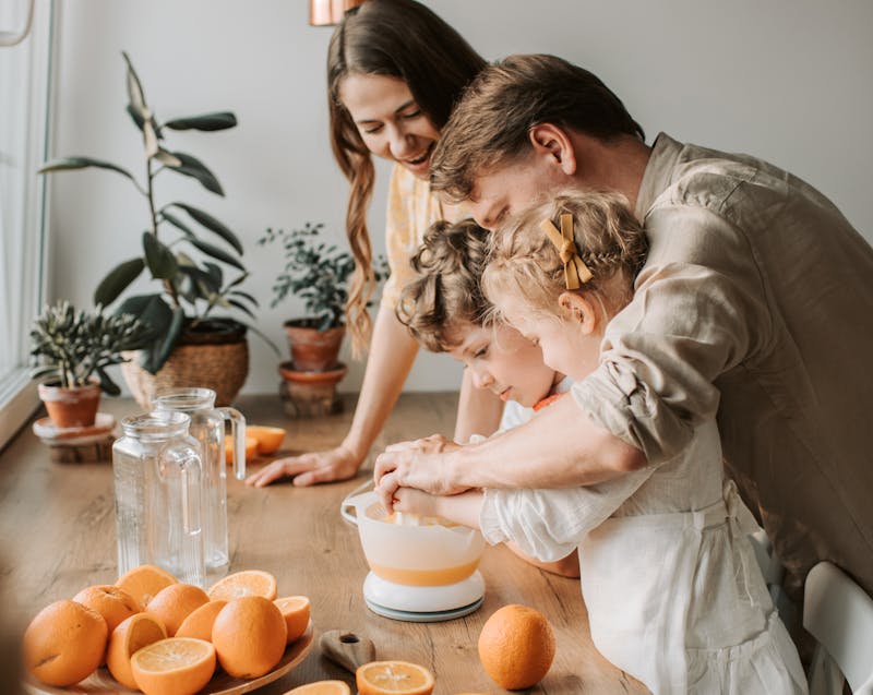 a family preparing juice together